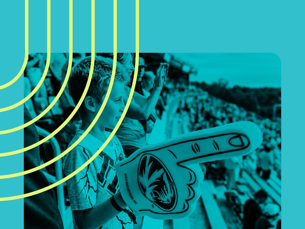 Fans at high school sports event with branded foam #1 finger - Branding guide for fan engagement in athletic programs