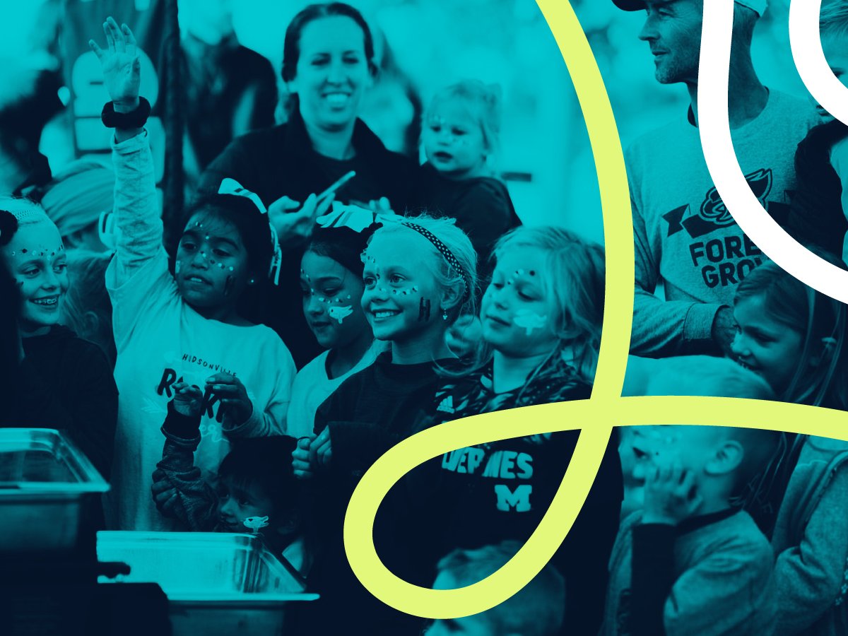 Diverse group of excited sports fans cheering together - Top 10 fan engagement ideas for high school athletics
