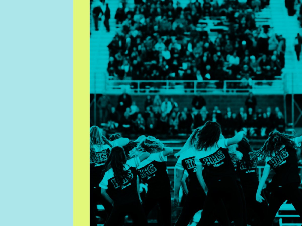 Packed high school stadium bleachers with engaged fans cheering - The Value of Fan Engagement guide for athletic directors